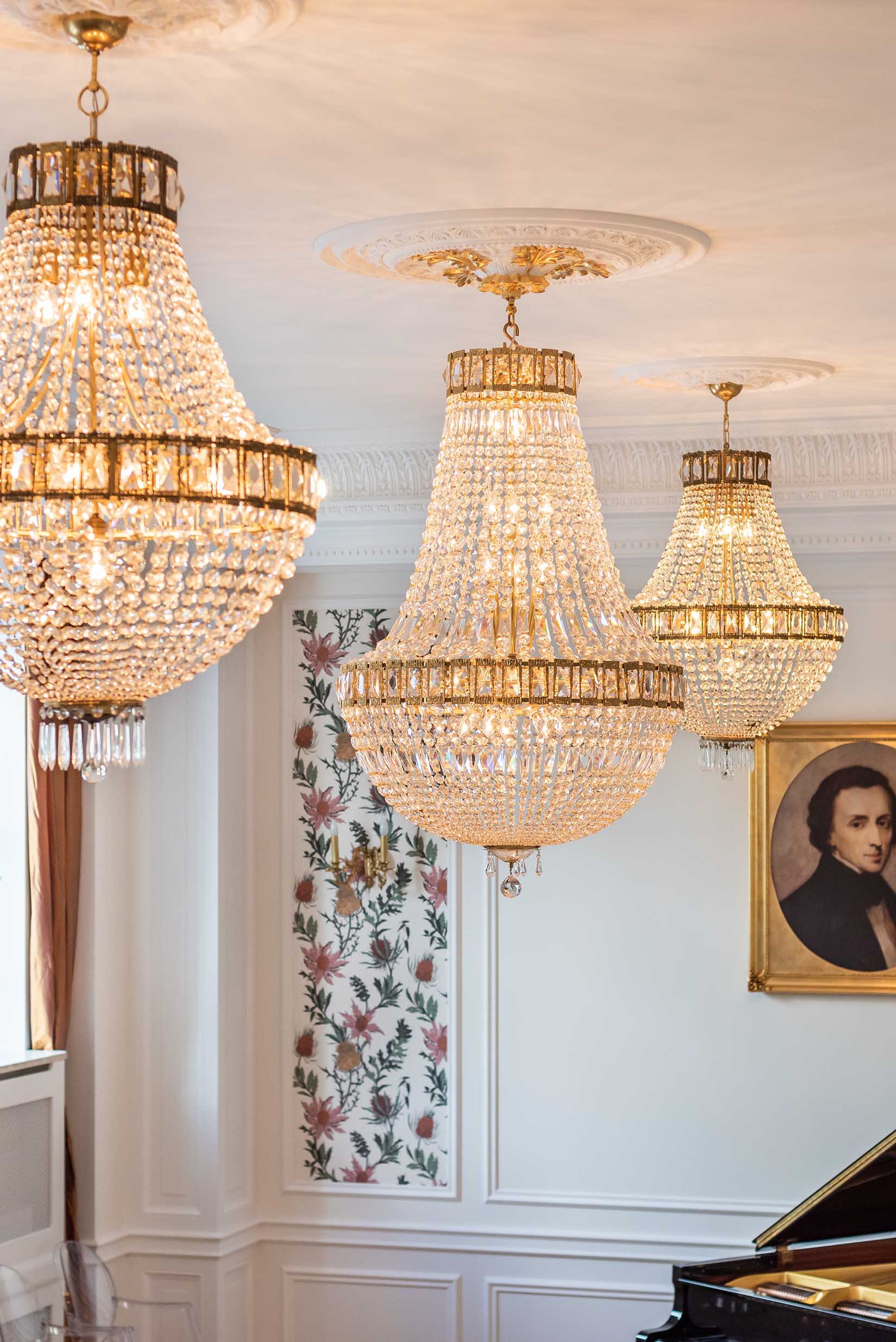 Three Swarovski chandeliers hanging at Fryderyk Concert Hall